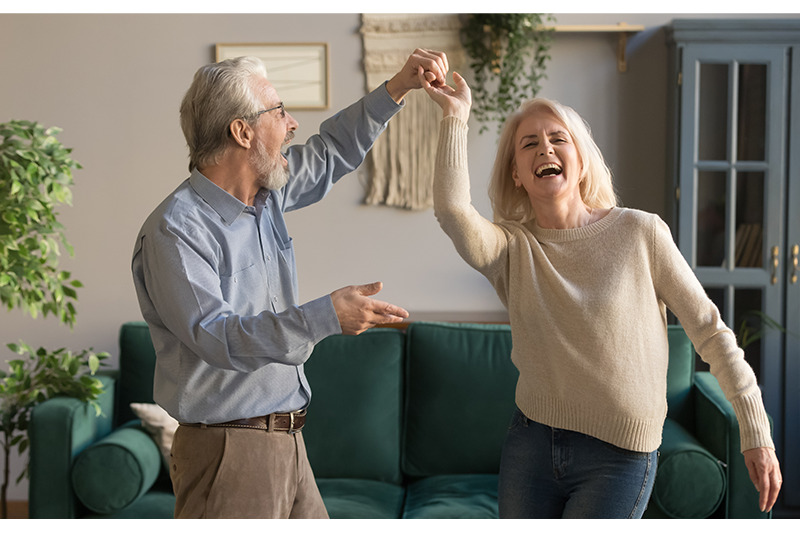 Man and woman dancing and laughing